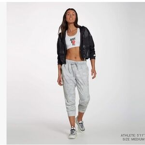 NIKE  Women's Dri-FIT Rebel Fleece 7/8 Training Pants - S